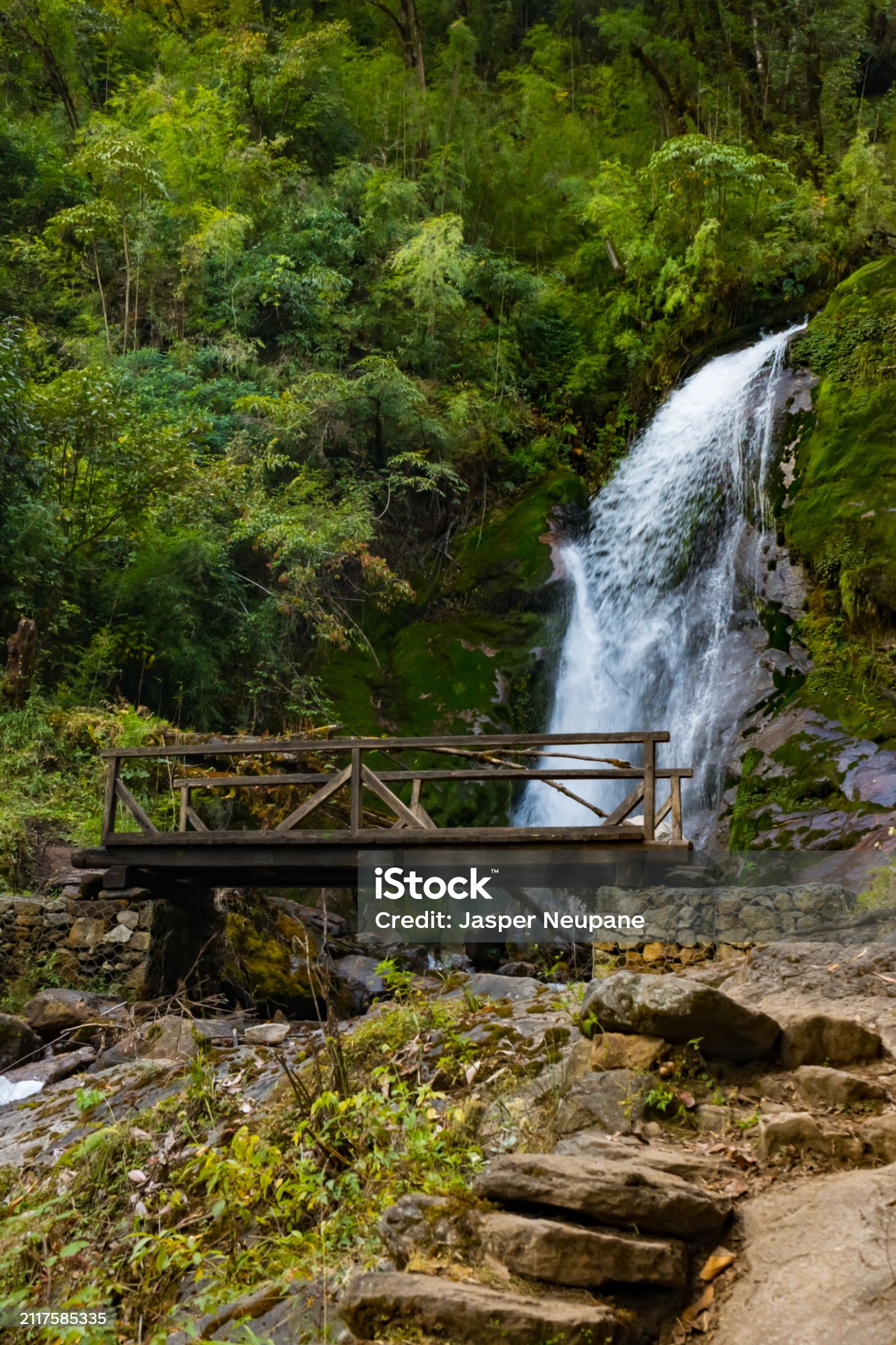 A waterfall with wooden bridge in Thangyam Village of Taplejung, Kanchenjunga Trek, Nepal