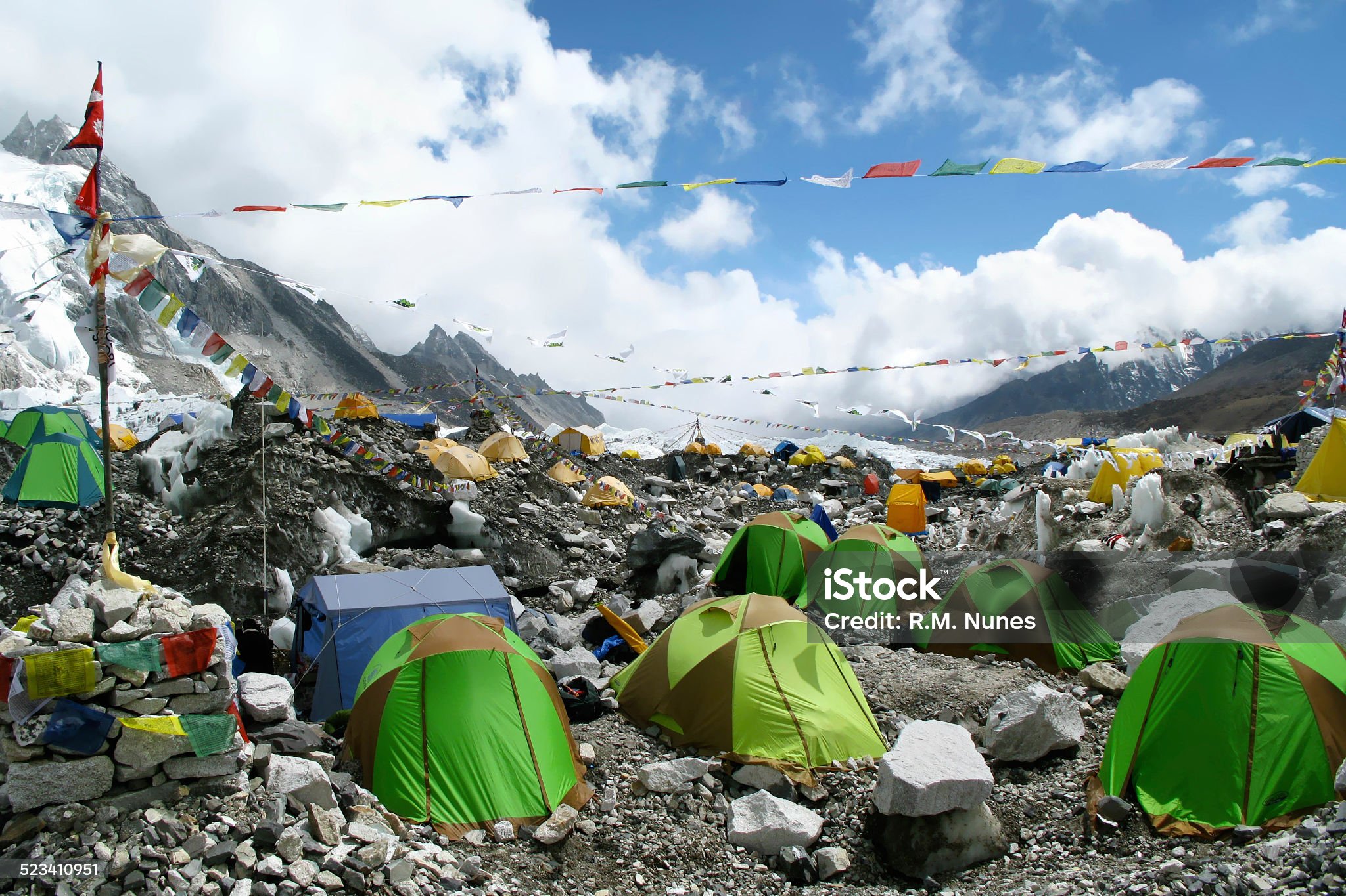 Colorful tents and Tibetan prayer flags at Everest Base Camp, Khumbu Region, Nepal.